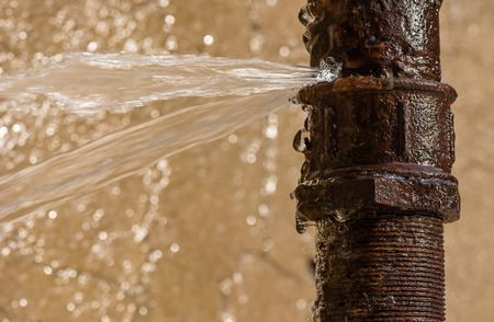 stock-photo-rusty-burst-pipe-spraying-water-after-freezing-in-winter-356451788_1.jpg