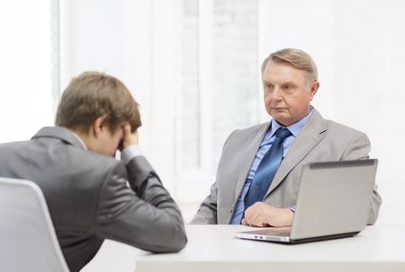 stock-photo-business-technology-and-office-concept-older-man-and-young-man-having-argument-in-office-171331082_1.jpg